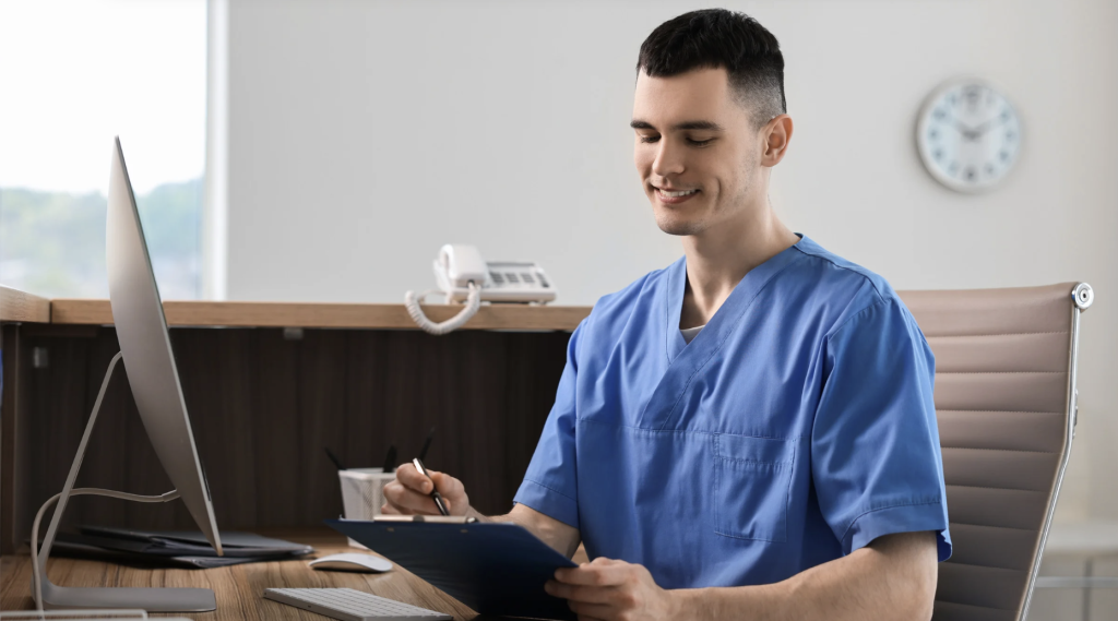 medical assistant smiling while holding a file
